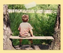 Image of boy sitting on bench